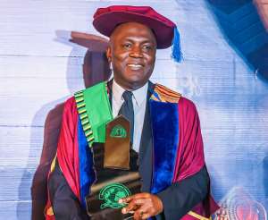Mr. Moses Baiden, the Founder and Chief Executive Officer of Margins ID Group with the award
