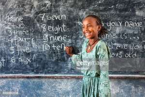 African little girl during her English class - Getty Images