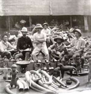 Members of the notorious British Punitive Exhibition of 1897 posing proudly with looted Benin ivories and bronze objects.