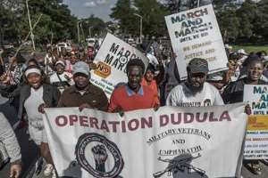Members of “March and March” and “Operation Dudula” chant anti-migrant slogans during a protest march in Durban, South Africa, in May 2026. - Source: Rajesh Jantilal/AFP via Getty Images.