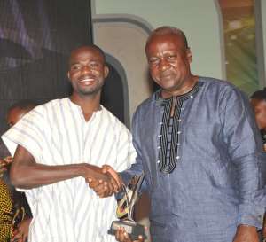 File Photo: Manasseh with President John Mahama when he received the National Youth Achievers’ Award for Media Excellence in 2012