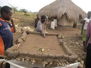 Africans are naturally healthy and happy people: A locally made clay pool board in a village.