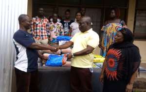 Hon. Owusu Bespectacled Presenting The Items To The Victim