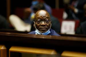 Former South African president Jacob Zuma stands in the dock at a separate trial at the Pietermaritzburg High Court in May.  - Source: Photo by PHILL MAGAKOEPOOLAFP via Getty Images