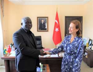 KoKMA MCE, Nii Adjei Tawiah , left exchanging pleasantries with the Turkish Ambassador to Ghana ,H.E Ozlem Egun