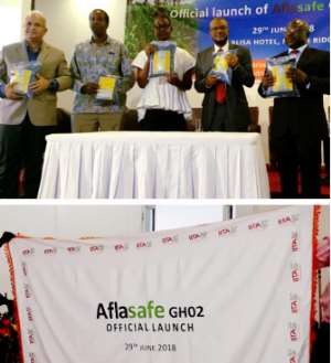Aflasafe unveiled! Showing off packs of Aflasafe GH02 at its launch in Accra, Ghana are left to right, above: Dr Ranajit Bandyopadhyay, Principal Scientist Plant Pathology and Research Leader of the Africa-wide Aflasafe Initiative at IITA; Dr Seydou Samake, the USDA and USAID Regional Sanitary and Phytosanitary Policy Advisor; Mr Harry Blepony, Deputy Director of Crop Services at the Ministry of Food and Agriculture, representing Dr Owusu Afriyie Akoto, the Minister for Food and Agriculture;