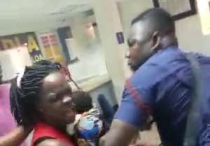 Ghanaians Outrage As Police Officer Beats Up Woman Holding Baby