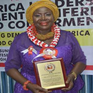 Hajia Damata Sulemana displays her award