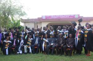The graduates in a group photograph with dignitaries after the ceremony