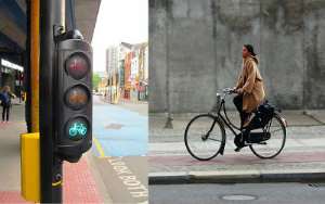A lady on her way to work under a bicycle traffic light regulation to secure her safety. Which part of Ghana can cyclists traffic light be found?