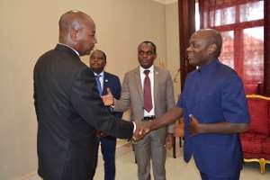 Justice Ore in the middle introduces Justice Matusses on the right Guinea Bissau President on the left