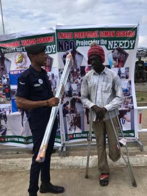 Police Officer Supports The Physically Challenged