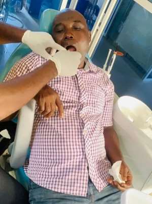 Journalist Miebi Binafiai is seen in a hospital after losing a tooth when he was attacked in Bayelsa State. Photo: Folaranmi Femi