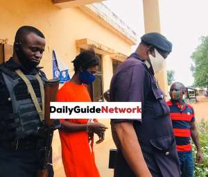 Accused person Latifah Bumaye being escorted by police at Bole District Magistrate Court