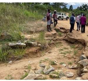 The MP interacting with some constituents on one of the bad roads