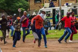 Protesters and police clash during a march against illegal immigrants in South Africa. - Source: Alet PretoriusGallo ImagesGetty Images