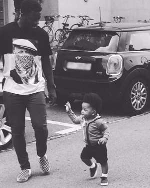 Sulley Muntari performs daddy duty in new photo