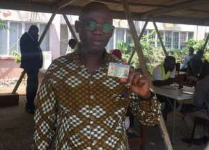 GES Director-General Professor Kwasi Opoku-Amankwa displays his Ghana card