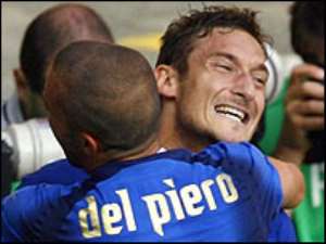 Totti celebrates after snatching a dramatic last-gasp win for Italy