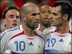 Zidane celebrates with his team-mates after the winning penalty