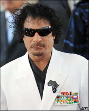 Col Gaddafi seems to have a fresh outfit for every occasion