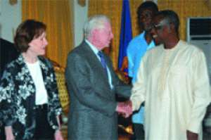 President Mills welcoming Mr Jimmy Carter 2nd right, a former President of the US and his wife, Roselyn to his office at the Castle. With them is the Chief of Staff, Mr John Henry Martey-Newman.