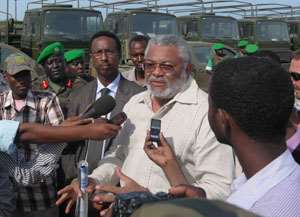 President Rawlings making his remarks at the handing over ceremony. in the background are some of the military vehicles