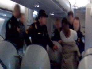 UMAR AFTER HIS ARREST IN THE PLANE. Photo: CNN