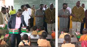 The Accra Mayor and some heads of the assembly addressing some pupils left, Deputy Minister of Information Agyenim Boateng giving out some school kits to the kindergarten class of the Socco Primary School right