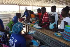 Angolan refugees having recently returned from Namibia wait in line to be served food.  By Estelle Maussion (AFP/File)