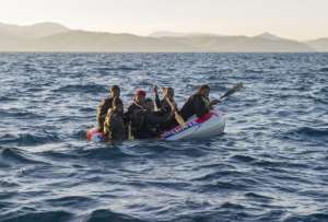 Would-be immigrants in an inflatable boat off the Spanish coast on December 3, 2012.  By Marcos Moreno AFPFile