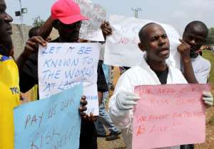 Health workers demonstrate in Liberia's capital Monrovia on April 18, 2015 to demand risk benefits promised by the government.  By Zoom Dosso AFP