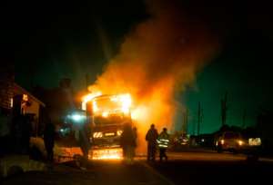 A bus burns on the infamous Kampala-Masaka road, a major access route from the Kenyan coast through Uganda to the Democratic Republic of Congo, Rwanda and Burundi.  By Michele Sibiloni AFPFile