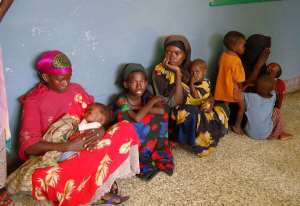 Somali women hold their malnourished children as they wait to admit them at the Mogadishu Banadir hospital.  By Mustafa Abdi AFPFile