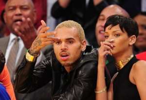 US singers Chris Brown (L) and Rihanna watch an NBA game in Los Angeles on December 25, 2012.  By Robyn Beck (AFP/File)