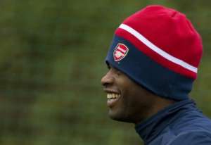 Arsenals Alex Song arrives for a training session at the clubs London Colney practice ground today.  By Adrian Dennis (AFP)