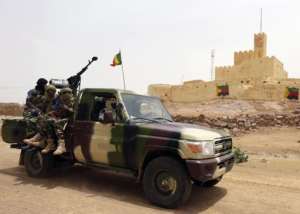 Malian soldiers patrol in Kidal on July 29, 2013.  By Kenzo Tribouillard AFPFile