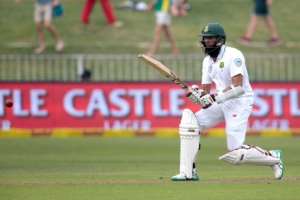 South Africa's batsman Hashim Amla plays a shot during the first Test against New Zealand at the Sahara Cricket stadium in Durban, on August 19, 2016.  By Gianluigi Guercia AFP