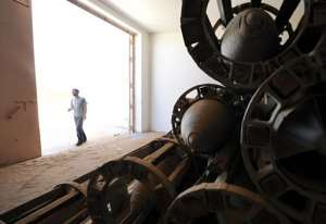 A Libyan man walks past stored ammunition some 100kms south of Sirte in 2011.  By Philippe Desmazes AFPFile