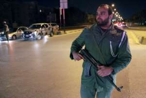 A Libyan policeman secures an area of Benghazi on January 15, 2013.  By Abdullah Doma AFPFile