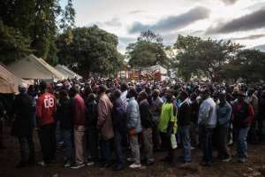 Malawians queue to vote after polling was delayed by several hours at a voting station in Blantyre central district during the general elections on May 20, 2014 in Blantyre.  By Gianluigi Guercia AFP