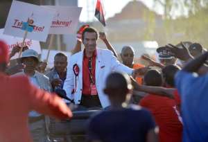 Supporters of the Botswana Democratic Party BDP cheer as incumbent Botswana President and leader of BDP, Ian Khama C arrives to address an election rally in Gaborone on October 18, 2014.  By Monirul Bhuiyan AFPFile