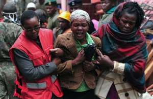 A Kenyan woman mourns the loss of a relative after a building collapse in Nairobi on April 30, 2016.  By Simon Maina AFP