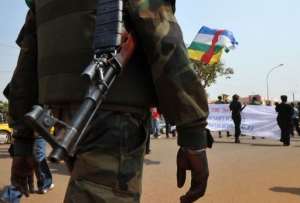 A soldier ensures security during a women's march in Bangui against the current conflict, on December 28, 2012.  By Sia Kambou AFP