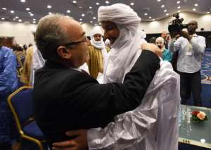 Algerian Foreign Minister Ramtane Lamamra L hugs Mali's Bilal Acherif, the general secretary of the National Movement for the Liberation of Azawad, during a peace agreement ceremony on March 1, 2015 in Algiers.  By Farouk Batiche AFPFile
