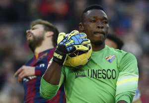 Former Cameroon goalkeeper Carlos Kameni (R) helped Malaga to a 1-0 win over Barcelona in La Liga.  By Lluis Gene (AFP)