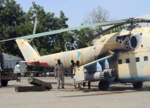 File picture shows Chadian government soldiers loading rockets onto a MI24 combat helicopter in the capital N'Djamena on February 4, 2008.  By Pascal Guyot AFPFile