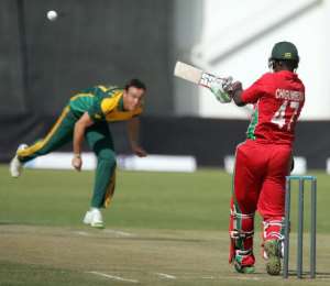 Zimbabwe captain Elton Chigumbura R bats during the third and final one-day international against South Africa at the Queens Sports Club in Bulawayo, on August 21, 2014.  By Jekesai Njikizana AFP