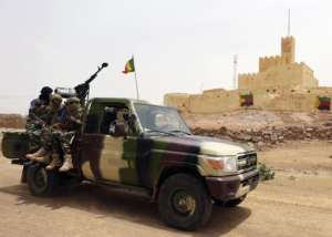 Malian soldiers patrol in Kidal, northern Mali, on July 29, 2013.  By Kenzo Tribouillard AFPFile