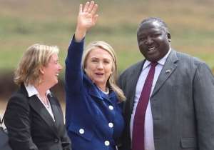Uganda's Foreign Minister Okello Oryem R welcomes US Secretary of State Hilary Clinton.  By Isaac Kasamani AFP